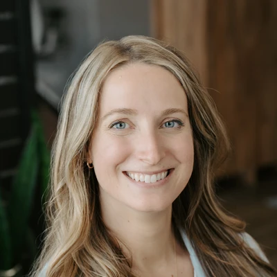 Danielle Hennes Smiles Warmly Welcoming Potential Patients