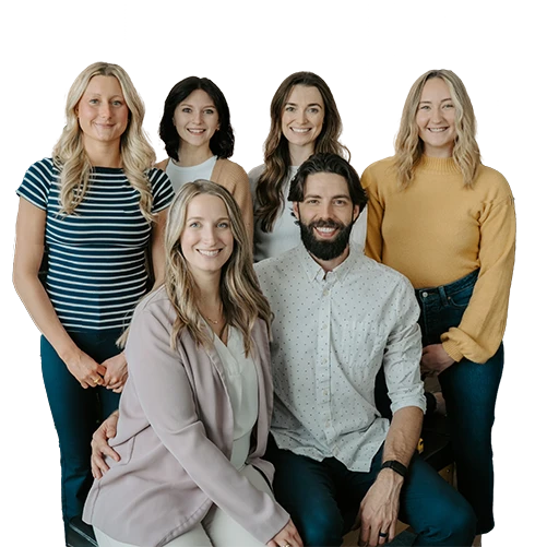 Chiropractor Zionsville IN Benjamin and Danielle Hennes With Team Cutout 2